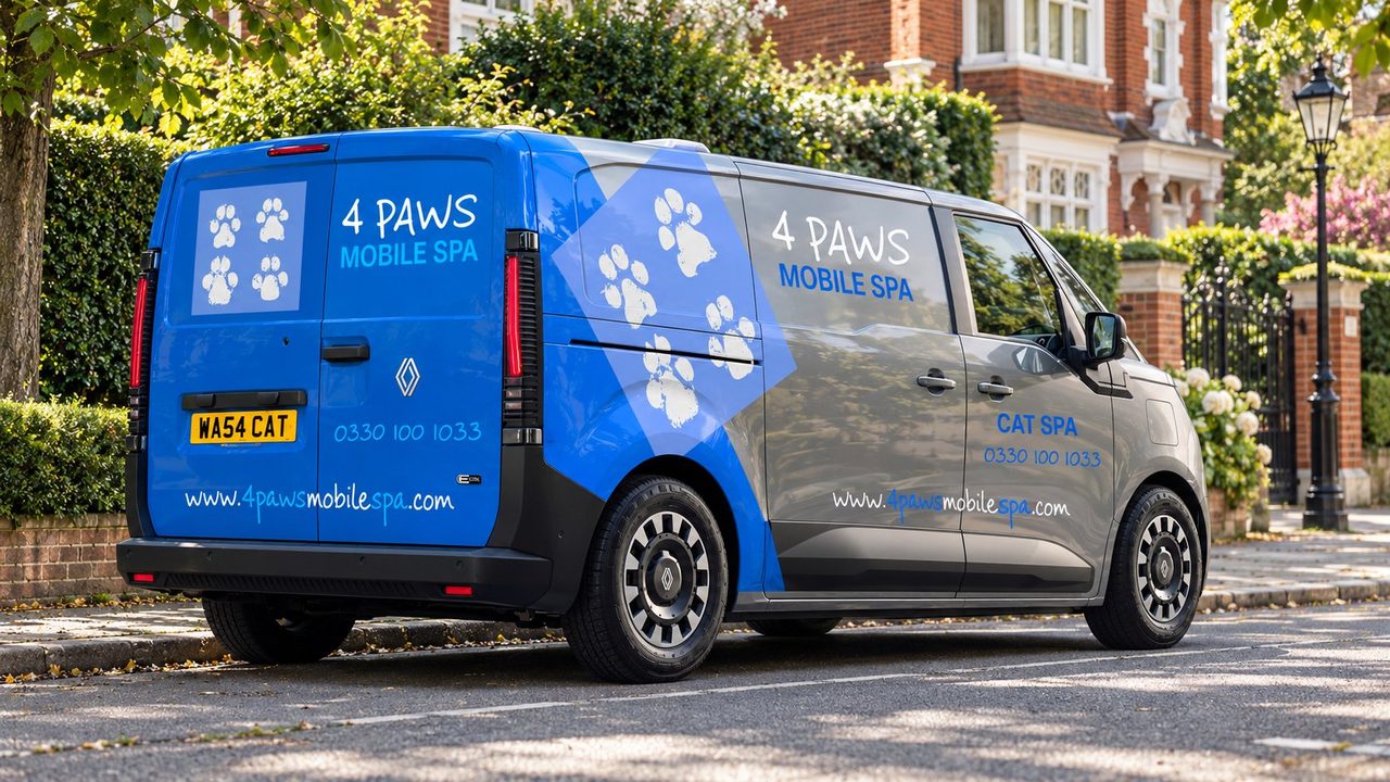 A 4 Paws Mobile Cat Spa parked by a London lamp post